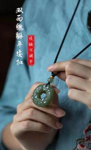 兩個貔貅頭對頭站在平安扣上面有什么寓意